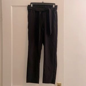 Black slacks with elastic waistband and belt
